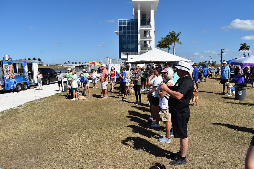 Onlookers watch the demonstration of service dog skills.