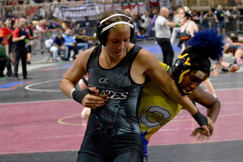 Braden River sophomore girls wrestler Giovanna Coppola escapes from the hold of Osceola's Kellianna Mack. Coppola would lose the match.
