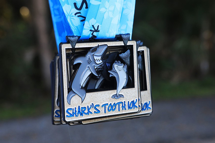 Runners picked up medals after the race.