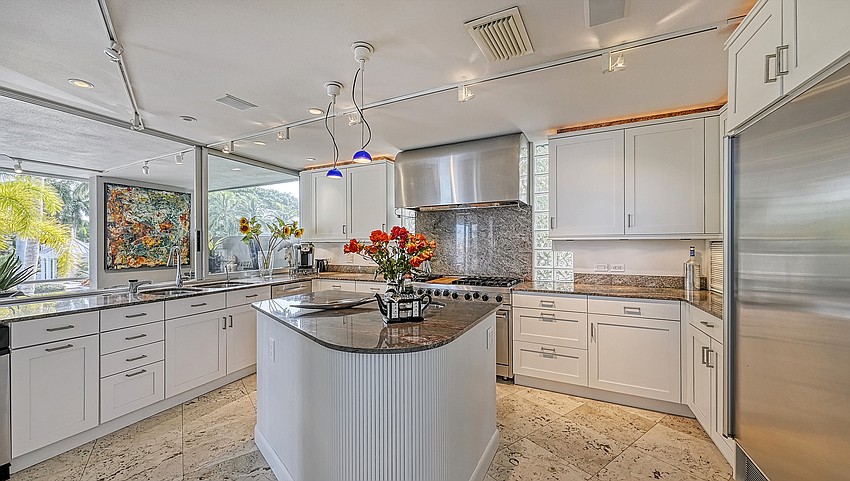 The kitchen is finished in granite and maple.