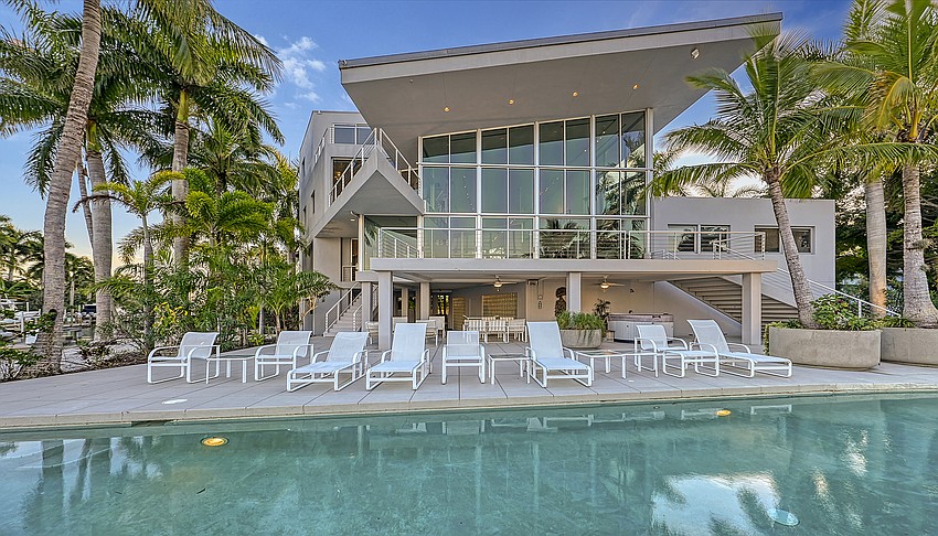 Overlooking the water is a 65-foot lap pool.
