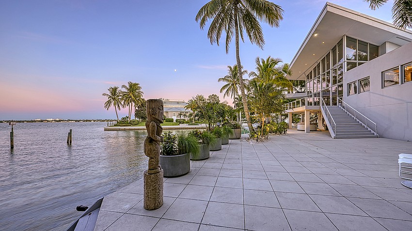 The Carl Abbott-designed home affords waterfront and city views.