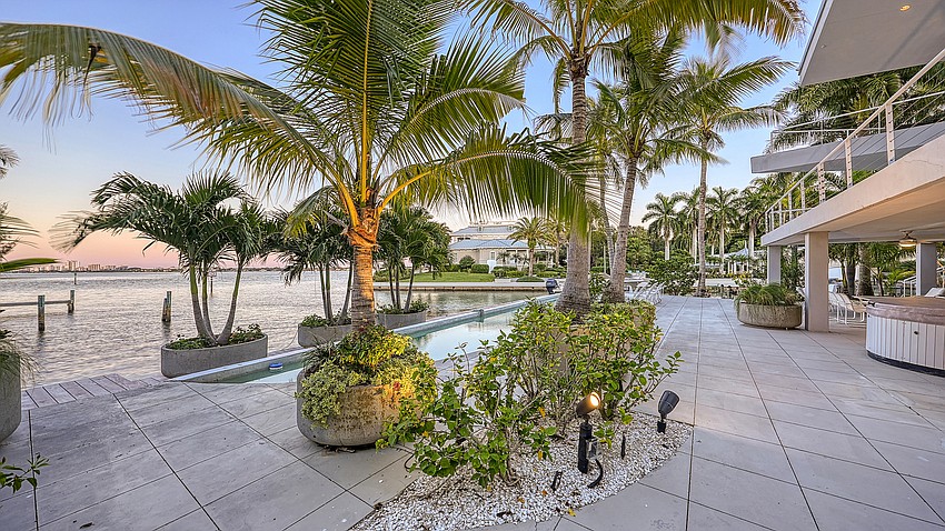 The Carl Abbott-designed home affords waterfront and city views.