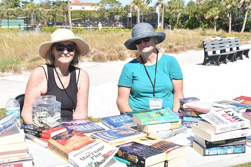 Longboat Library volunteers Judith Berson and Alice Edwards passed out free books.