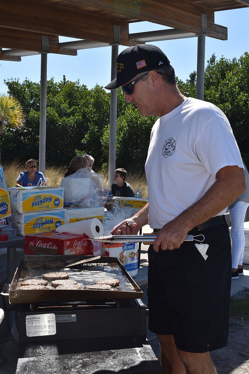 Fire Chief Paul Dezzi grilled burgers for attendees.