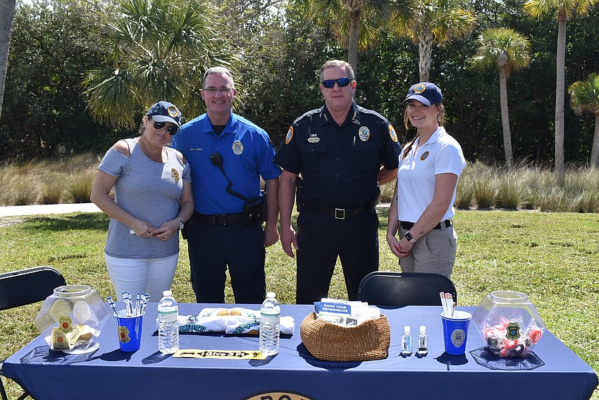 Amanda Modugno, Sgt. Connor Smith, Chief George Turner and Anne Mahoney at the police department's table.
