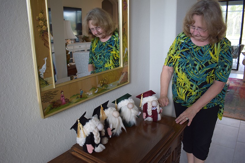 Gnome graduates sit in Linda McMillan's entry way.