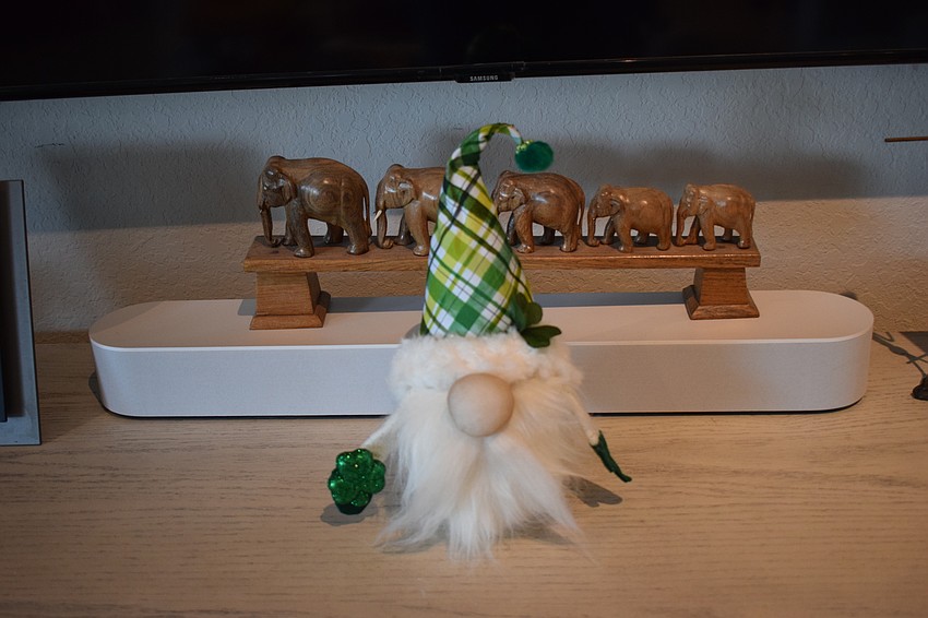 Behind a gnome in her living room is an example of her love of elephants.