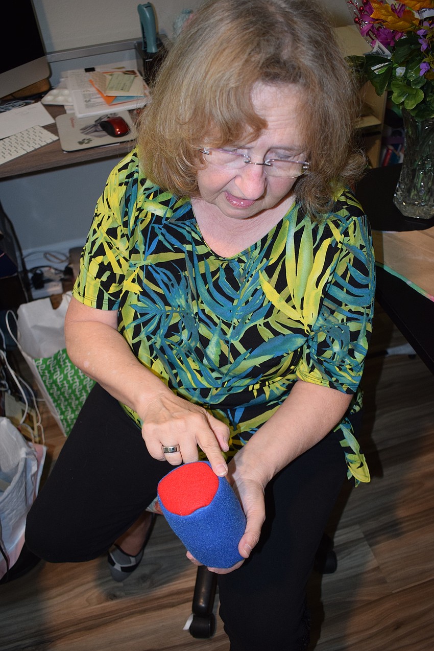 Linda McMillan holds the body of a gnome, which is filled with rice.