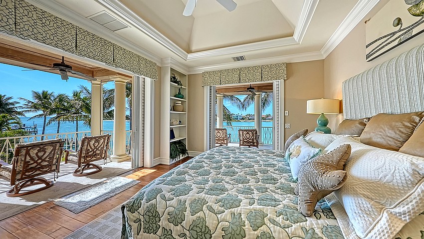 Bedrooms overlook the back yard and New Pass beyond.