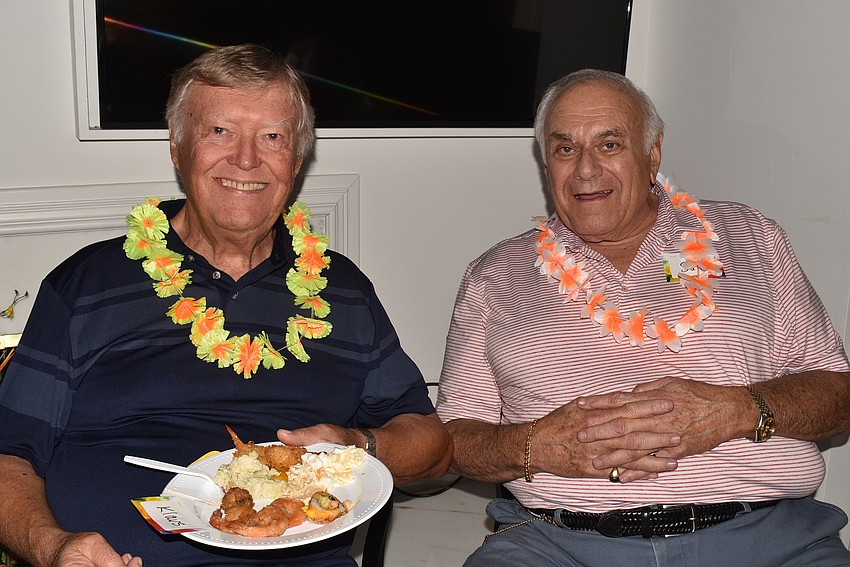 Klaus Tanter and Sam Samelson donned leis for the party.
