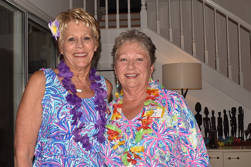 Michel Heutel and Judy Kottmeier matched leis to their outfits.