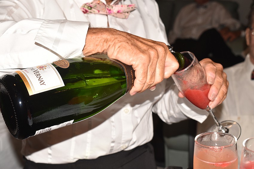 Connie DiMaggio poured strawberry bellinis for guests as they came in.
