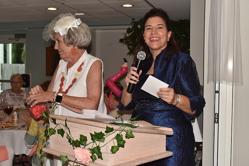 Jamie Peterson smiles as she presents the event.