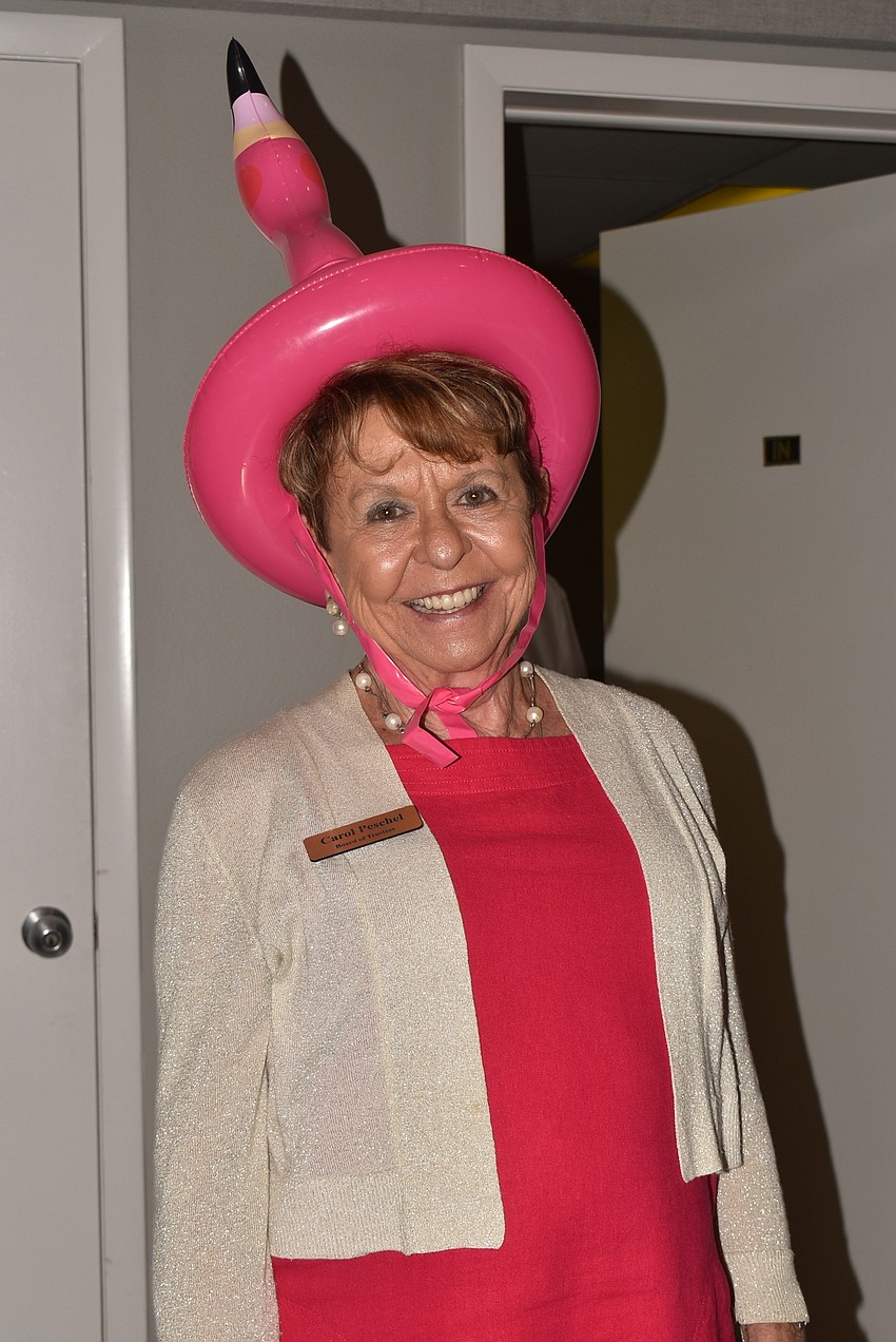 Carol Peschel shows off her flamingo hat.