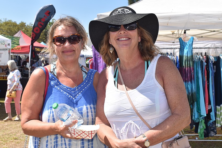 Angela House and Sue Hengel tried out food from the market.