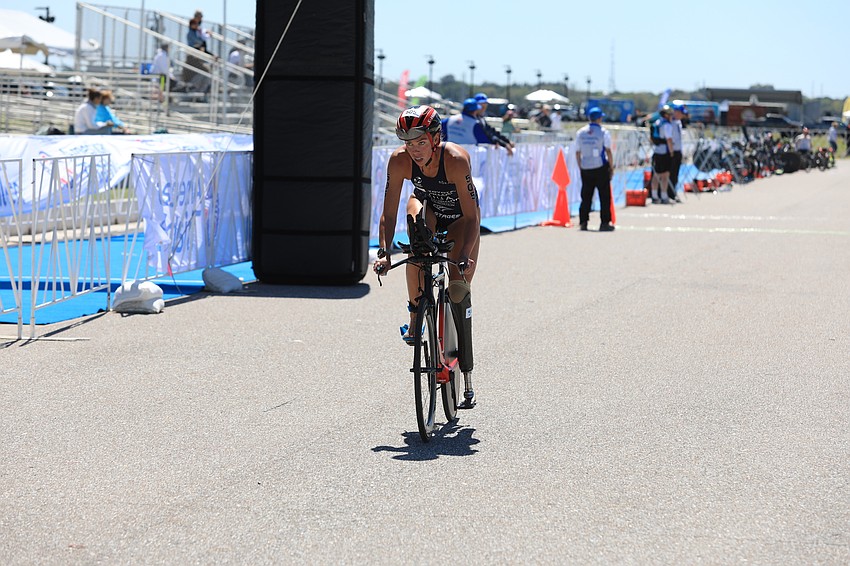 Grace Norman gets on her bike.