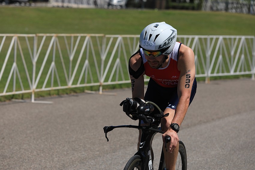 Jesus Moreno bikes through the park.