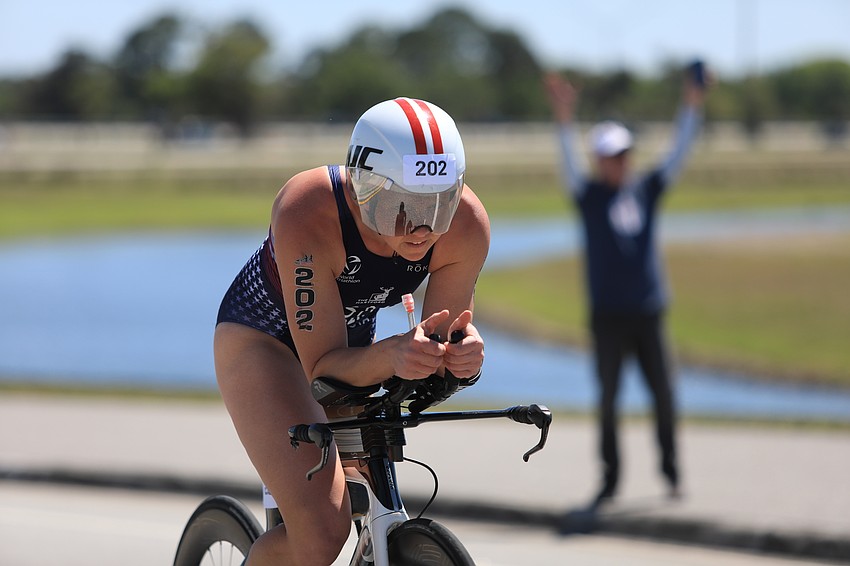 Hailey Danz bikes through the park.