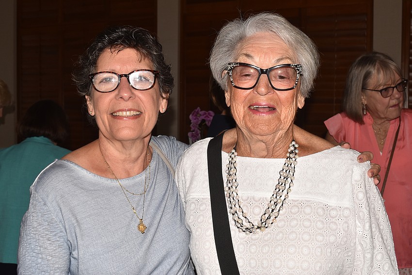 Jackie Michaelides and Florence van Howe looked at raffle baskets before lunch.