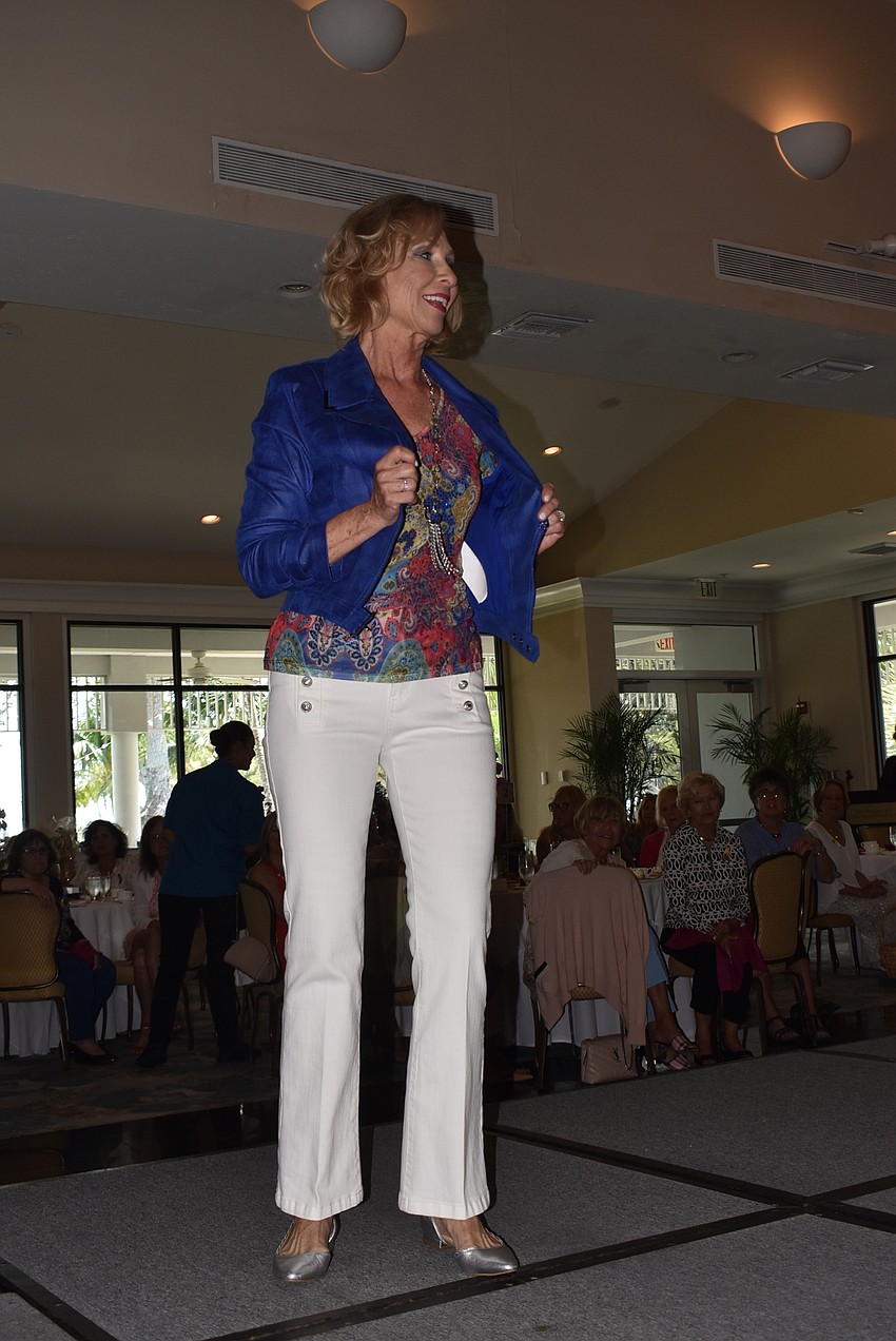 Sandy Montrone walks in a nautical shirt.