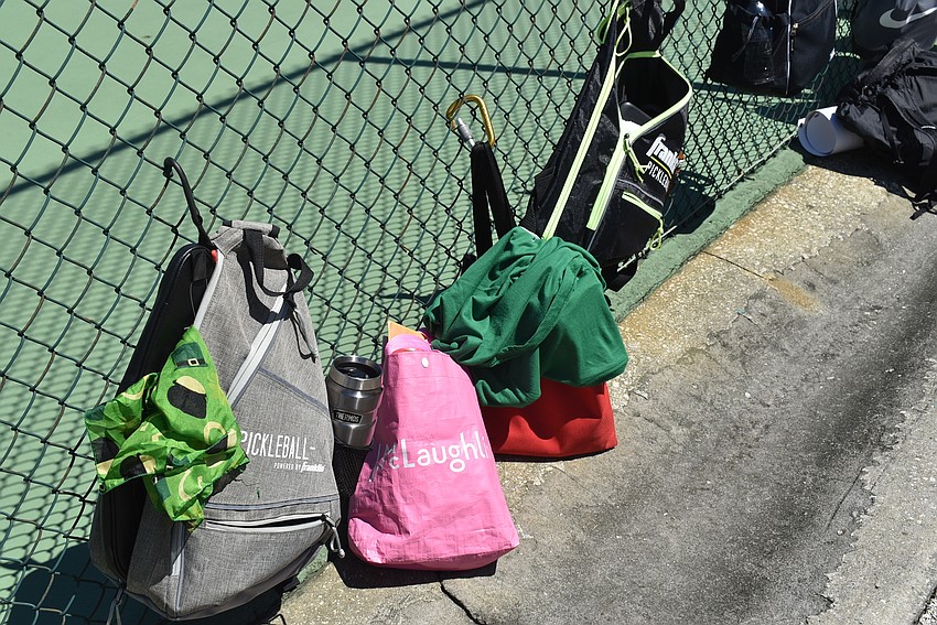 Players left their bags at the edge of the court while they played.