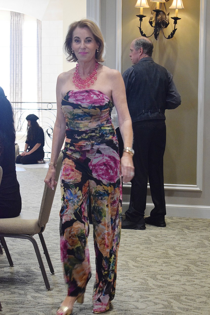 Lakewood Ranch's Jane Imperiale makes her way around the ballroom in a floral printed jumpsuit.