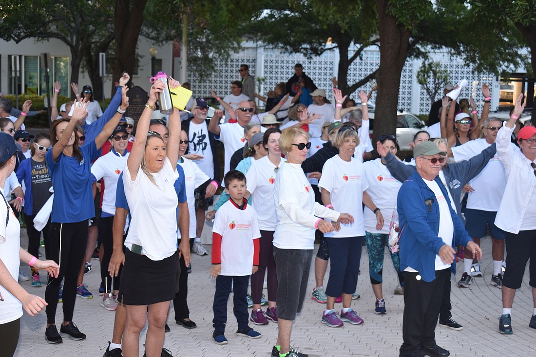 Participants stretch before the 2019 walk.
