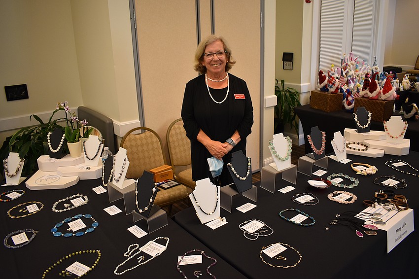Mary Litle creates jewelry from crystals, which she obtains from gem shows in the area.
