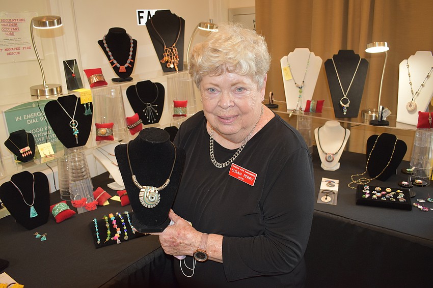 Susan Perry displays her jewelry, which is made out of everything from washers to green, rusted copper.
