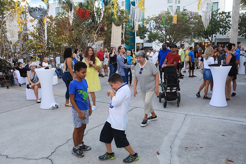 Attendees dance along to music.