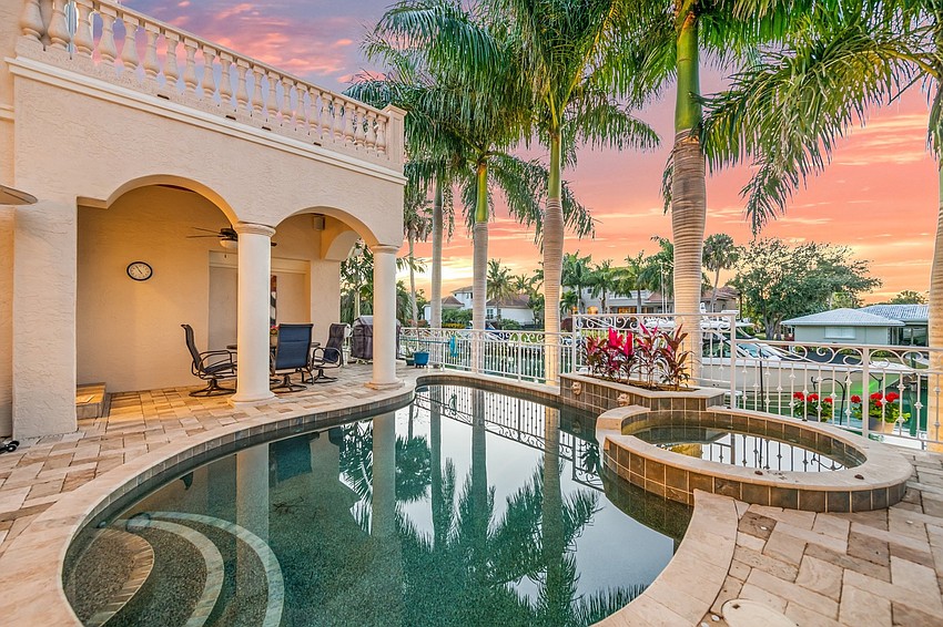 The property features .  a natural gas heated saltwater pool and hot tub.  (Courtesy Jayne DelMedico, ReMax Alliance Group)