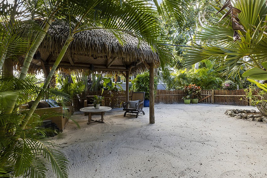 The home features a back yard tiki area. (Courtesy Jimmy Rabon, Berkshire Hathaway HomeServices Florida)