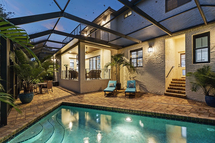 The heated custom pool is enclosed by an expansive screen.(Courtesy Jimmy Rabon, Berkshire Hathaway HomeServices Florida)