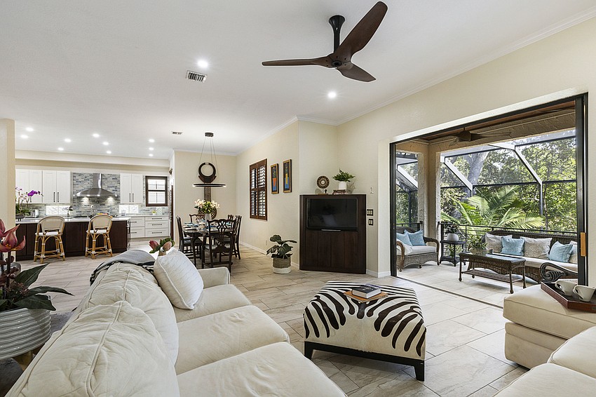 Living area overlooks the deep water canal. (Courtesy Jimmy Rabon, Berkshire Hathaway HomeServices Florida)