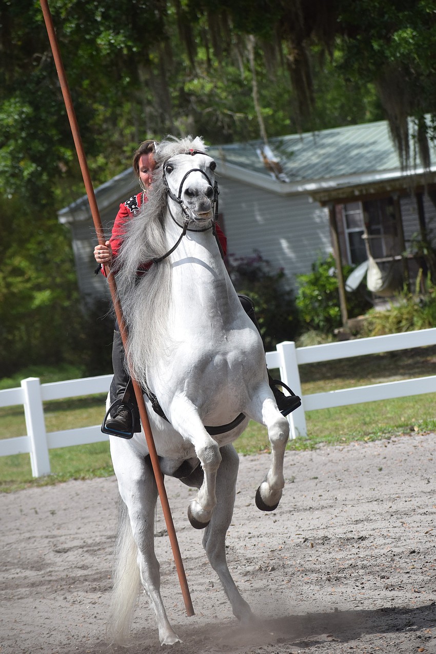Rebecca McCullough shows the crowd how a lance is used in the art of garrocha.