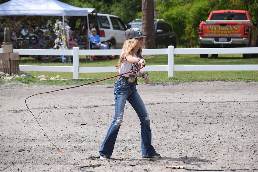 Madison Roberts of Myakka City cracks that whip to help open the show.