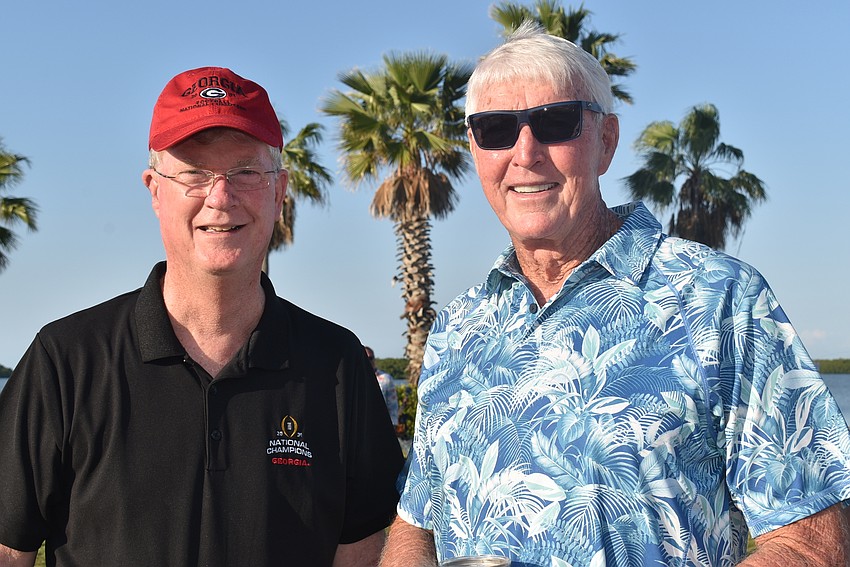 Steve Branham and Bill Dooley wait for food.