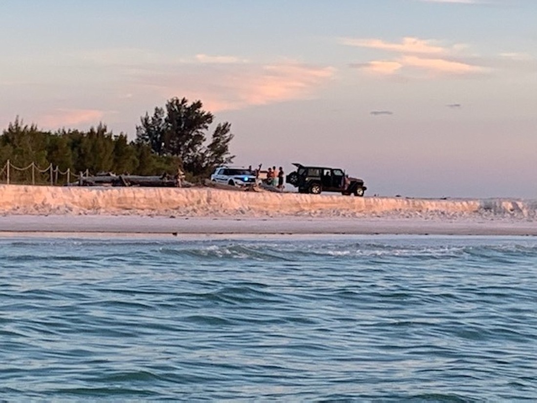 A photo provided to the town of Longboat Key shows a Jeep Wrangler parked on the beach at the end of North Shore Road.