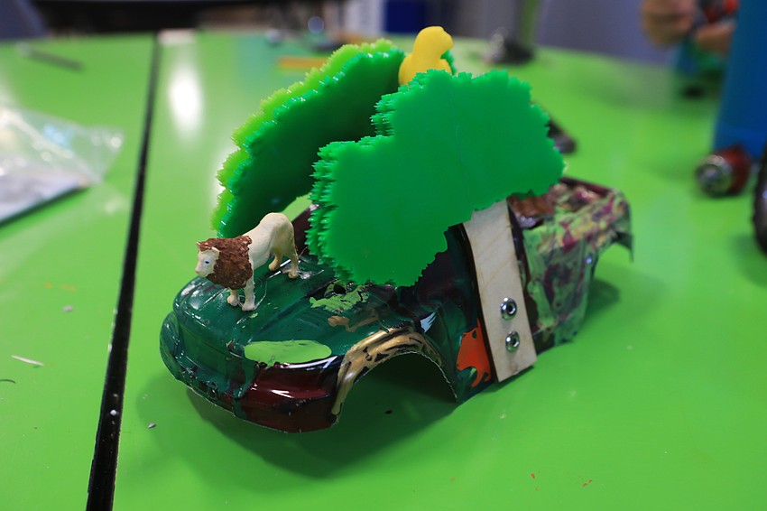 Racers put together their cars at the lab months in advance.