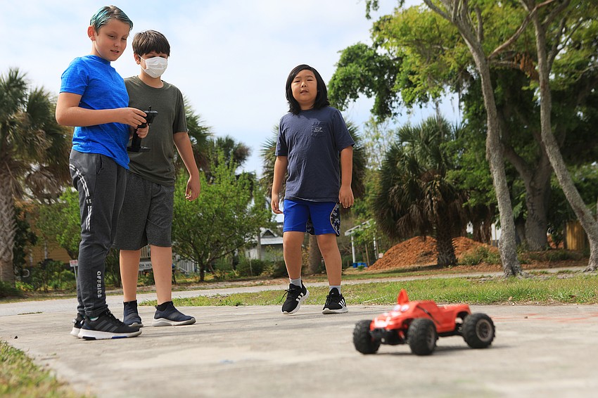 Nikolas Eckert, Sam Li and Noah Hoff practice with their tiger car.