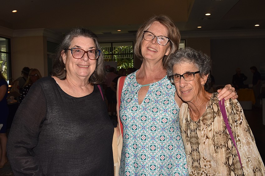 Debbie Cohen, Lynn Adelmann and Mac Spitzer made their way around the room.