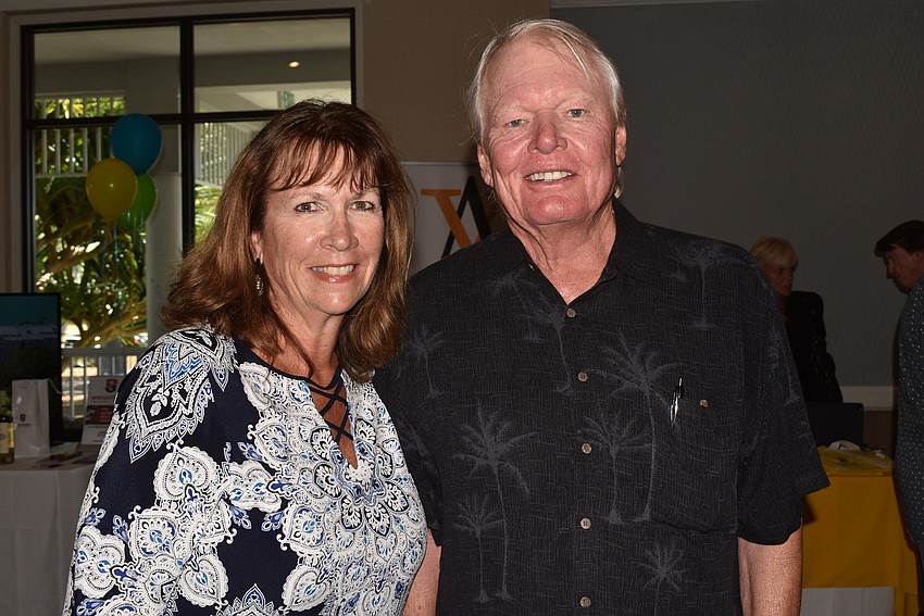 Holly Barrett from St. Armands Travel and Chris Wells, who both won the Observer's raffle basket.