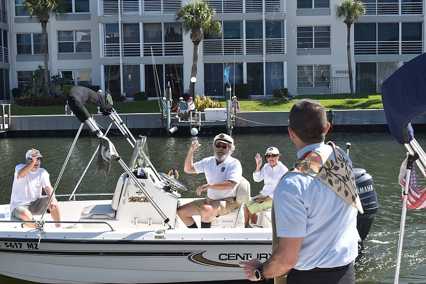 Dziedziak blesses Coughlin's boat.
