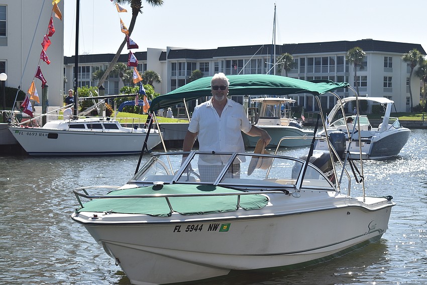 Jac Lentz waves to the crowd.