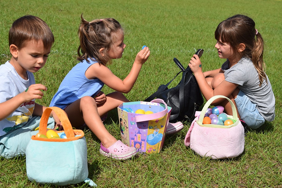 Greenbrook&#39;s Ian Carroway, Luisa Elizalde and Olivia Carroway assess their treasure after the hunt in 2019. File photo.