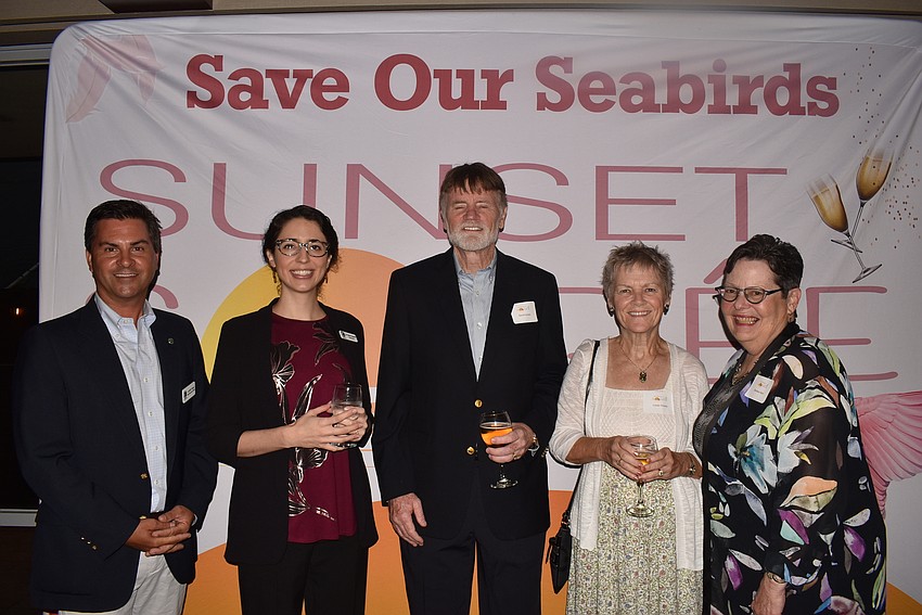 CEO Aaron Virgin and aviary vet Maria Passarelli with volunteers Dave Gnass, Linda Gnass and Barbara Kerr