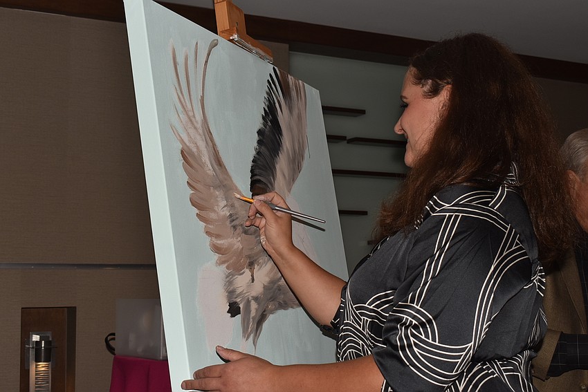 Nata Loginova painted during the event, and the result was auctioned off.