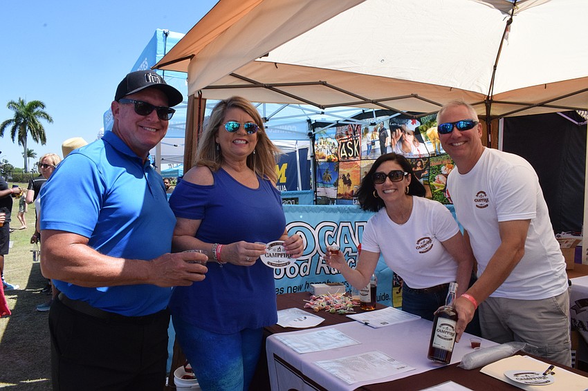 Jerry Lamb, Peggy Kronus and Brenda and Jon Kleiber, the owners of Campfire Coffee Liquor, enjoy a toast.