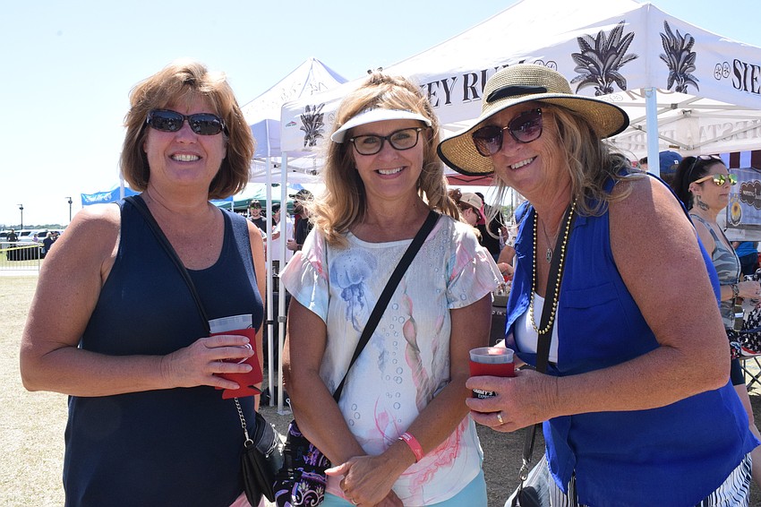 Nokomis' Debra Bellin has fun with her friend Cindy Verstegen, who is visiting from Wisconsin, and Nokomis' Karen Mariani at My Hometown Fest. 